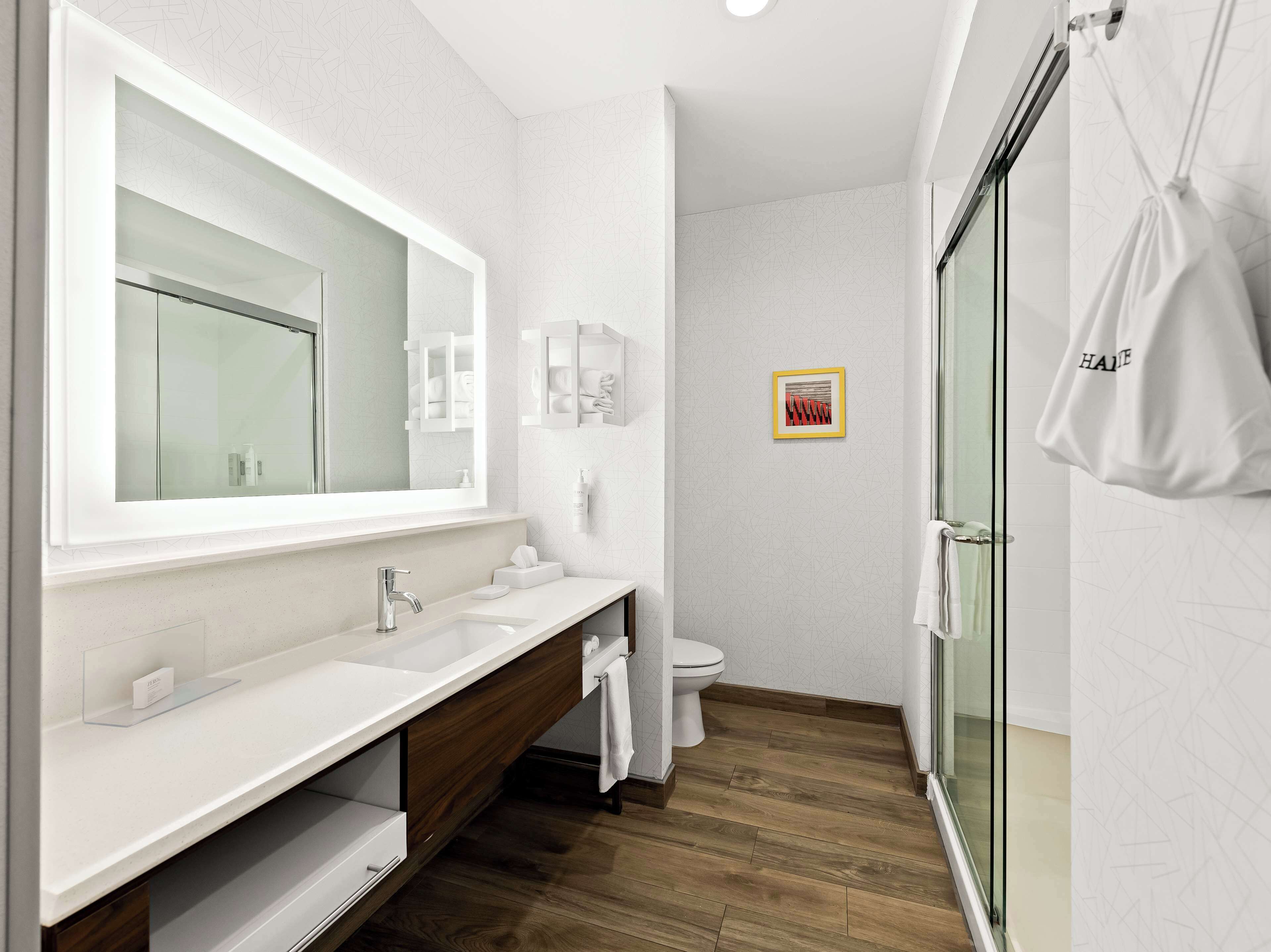 room, 1 king bed, refrigerator & microwave | bathroom | hydromassage showerhead, hair dryer, towels, soap