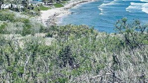 A coastal landscape with houses and a beach. - Caribbean Island Retreat, 200 degree water views, trade winds and soothing waves (Christiansted)