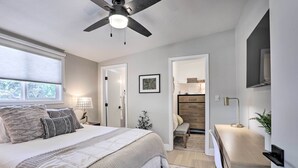 A bedroom with a bed, bedside table, lamp, and a ceiling fan. - Hot Tub, Fire Pit: Midtown Reno Oasis! (Reno)