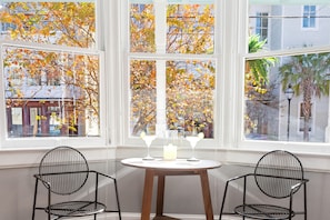 Enjoy a peaceful evening with a view of the surrounding landscape from the bay window.
