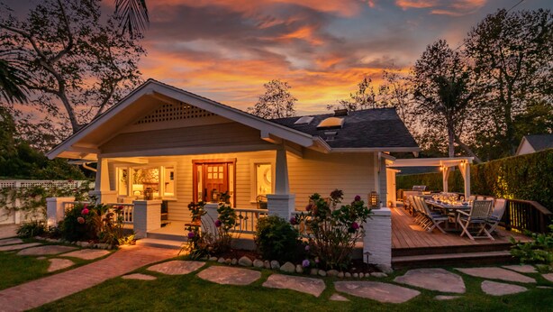 A house with a covered patio, a lawn, and a stone pathway leading to the entrance. - Montecito Craftsman | Walk to Beach, Hot Tub, Bikes, Game Room & EV Charging (Montecito)