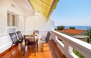 Enjoy a romantic dinner on the balcony with a stunning sea view.