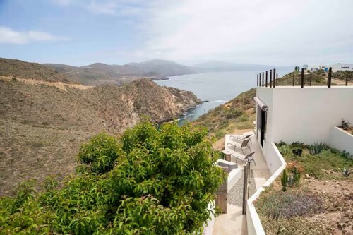 Eclectic Cliffside Den with Hanging Living Area