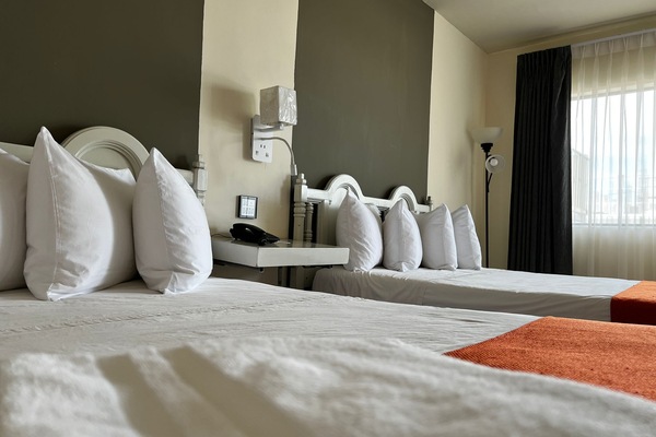 Deluxe Double Room, 2 Queen Beds | Desk, laptop workspace, free WiFi, bed sheets