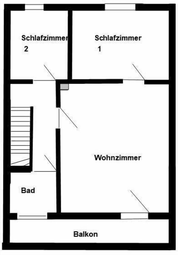 Un plan d’étage comprenant deux chambres, un salon, une salle de bain et un balcon.