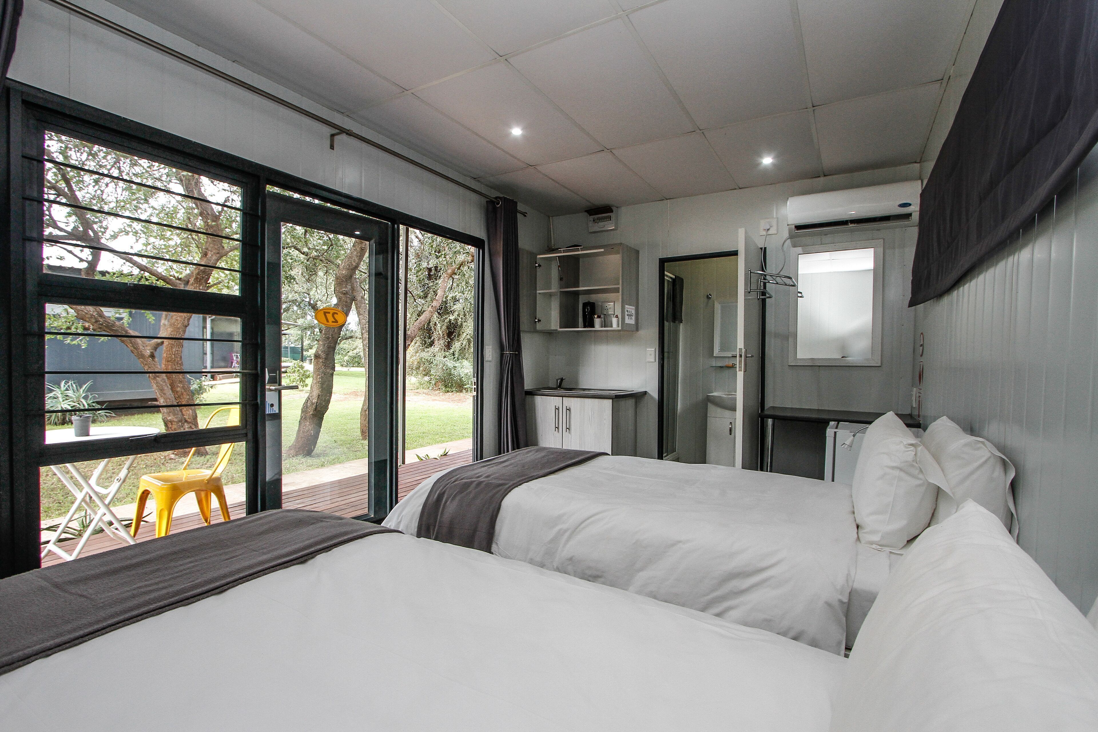 Minibar, desk, bed sheets