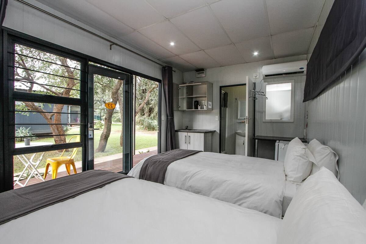 Minibar, desk, bed sheets