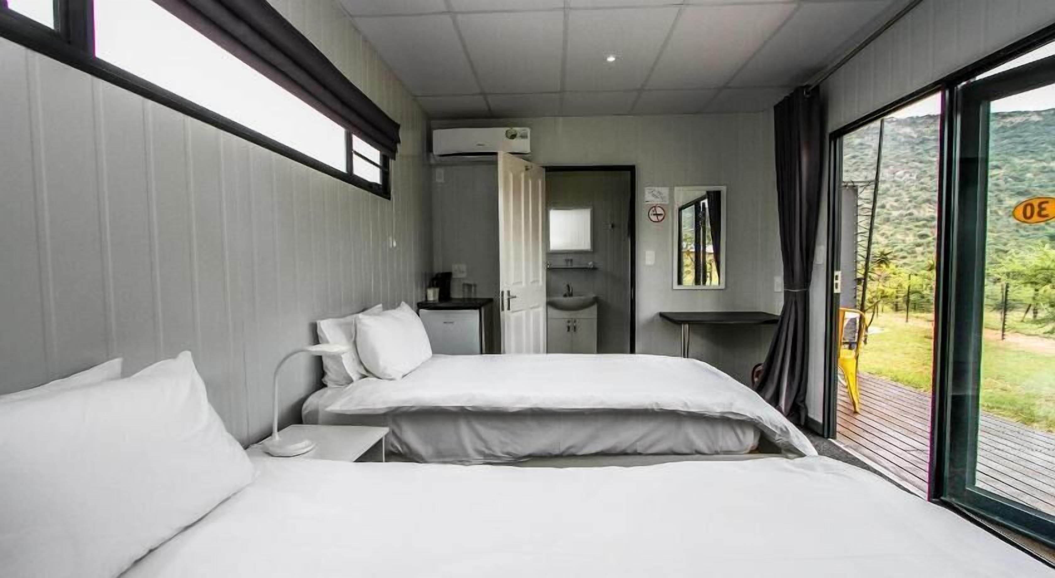Minibar, desk, bed sheets