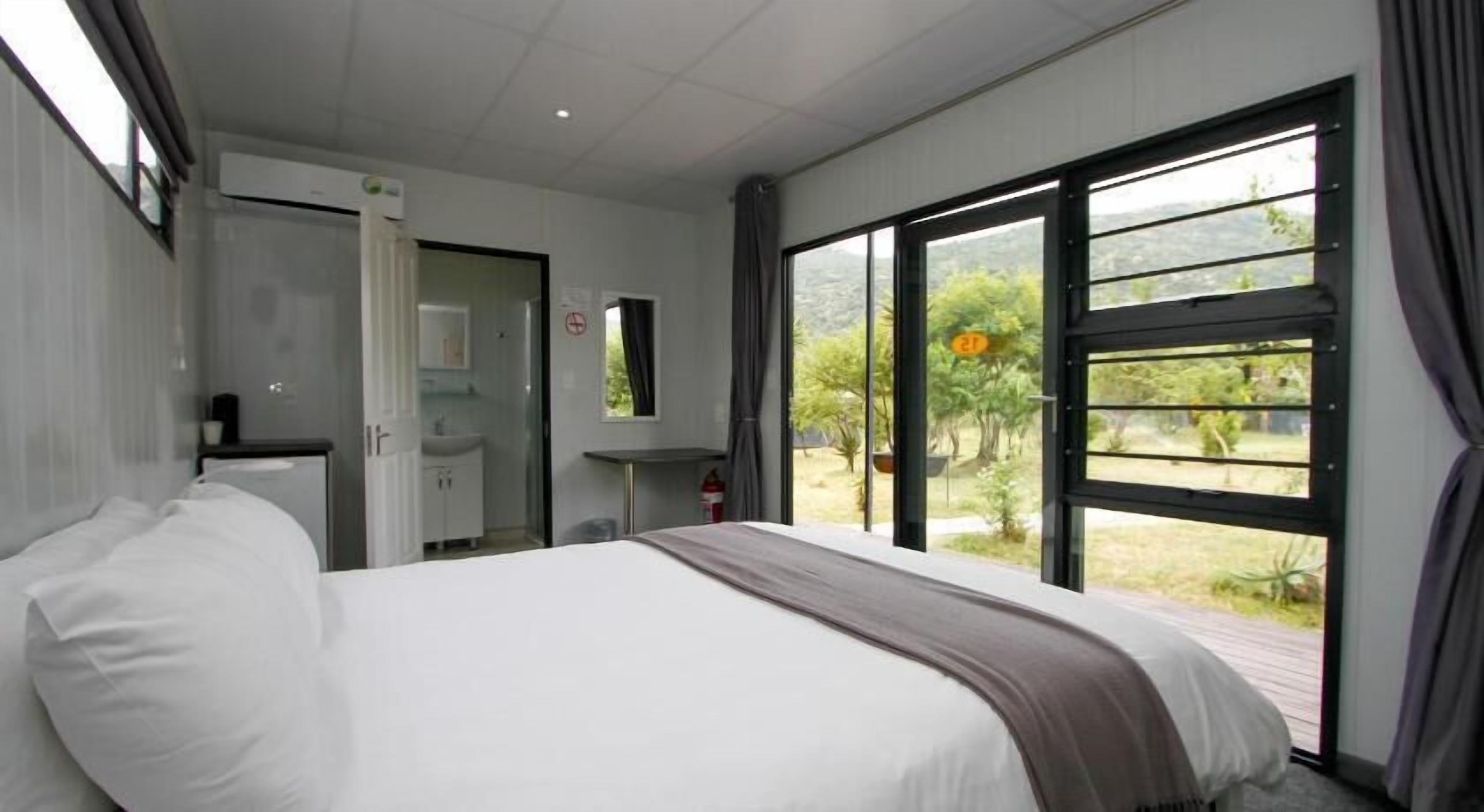 Minibar, desk, bed sheets