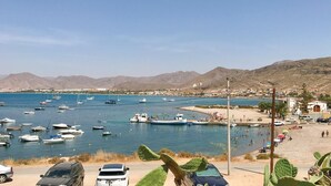 A coastal area with boats docked in a marina, a sandy beach, and a mountainous backdrop. - 6 bedroom beautiful home in La Azohia (La Azohia)