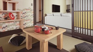 A traditional Japanese room with tatami flooring, a low wooden table with tea set, a futon bed, and shoji screens. - MIMARU SUITES Kyoto Central (Kyoto)