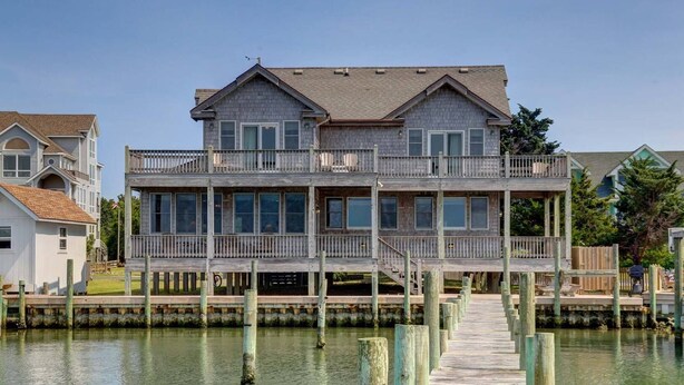 A waterfront house with a dock and a second-story balcony. - Spencer's Landing - Ocracoke Island (Ocracoke)