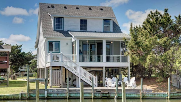 A two-story waterfront house with a covered deck and a staircase leading to the upper level. - The Dory - Ocracoke Island (Ocracoke)