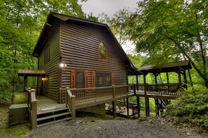 Exterior - Pet-friendly lakeside retreat with fire pit, hot tub, pool table, canoe, fishing dock, and WiFi for ultimate relaxation-LVE (Ellijay)
