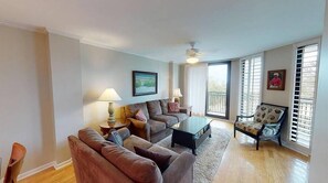 Relax in this inviting living room with a comfortable sofa set, armchair, and coffee table.