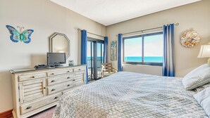 A bedroom with a bed, dresser, and a view of the ocean. - Horizon East 804 - Two Bedroom, Two Bath Oceanfront Condo (Garden City Beach)