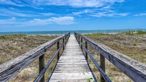 A wooden boardwalk leading to a beach with clear skies. - Love's A Beach - 5 Bedroom. 4 Bathroom, Oceanfront Dog Friendly Home (Garden City Beach)