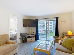 TV, books - 2 bedroom unit with an Ocean and Pool View! (New Smyrna Beach)