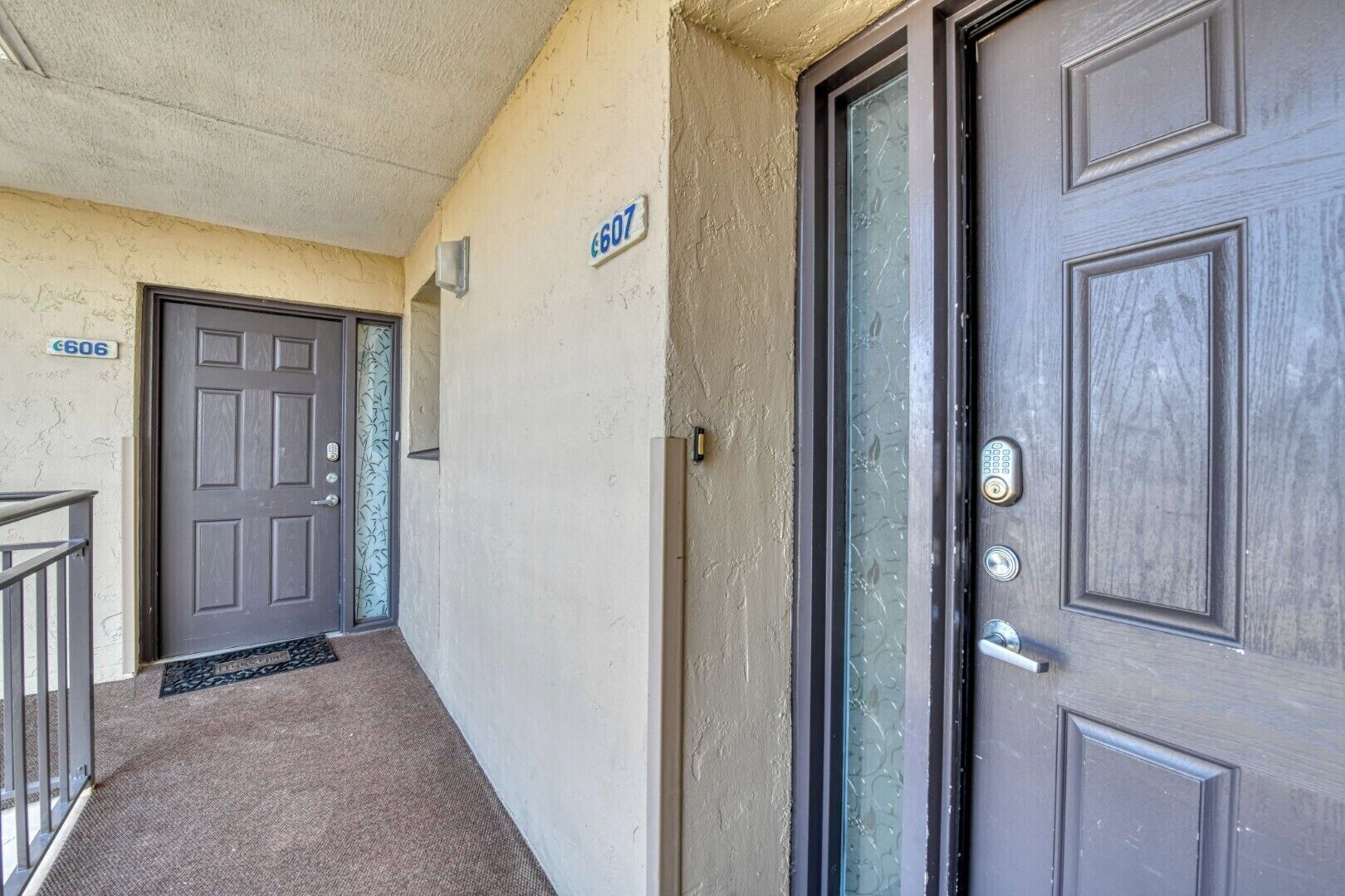 A corridor with two doors, each marked with a number.