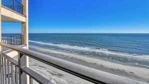 A balcony with a view of the ocean. - Surfmaster 909 - One-bedroom, one-and-a-half-bath oceanfront condo with pools (Garden City Beach)