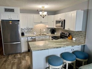 Fridge, microwave, oven, stovetop - Newly Remodeled 1st Floor Ocean Front Condo at Royal Garden Resort 105 (Murrells Inlet)