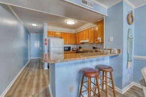 Coffee/tea maker, fridge, microwave, oven