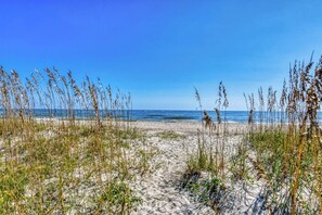 Enjoy a serene beach experience with calm seas and soft sand.