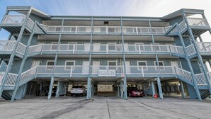 A multi-story building with a sign reading "Dundie Award Winner." - Duneside III 304, Oceanfront Condo close to Garden City Pier (Garden City Beach)