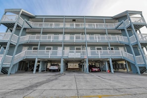A multi-story building with a sign reading "Dundie Award Winner." - Duneside III 304, Oceanfront Condo close to Garden City Pier (Garden City Beach)