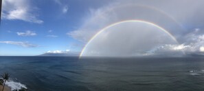 A view of the ocean with a rainbow over the water. - Mahana 604 Oceanfront 1bd/1ba 1 Bedroom Condo by RedAwning (Lahaina)