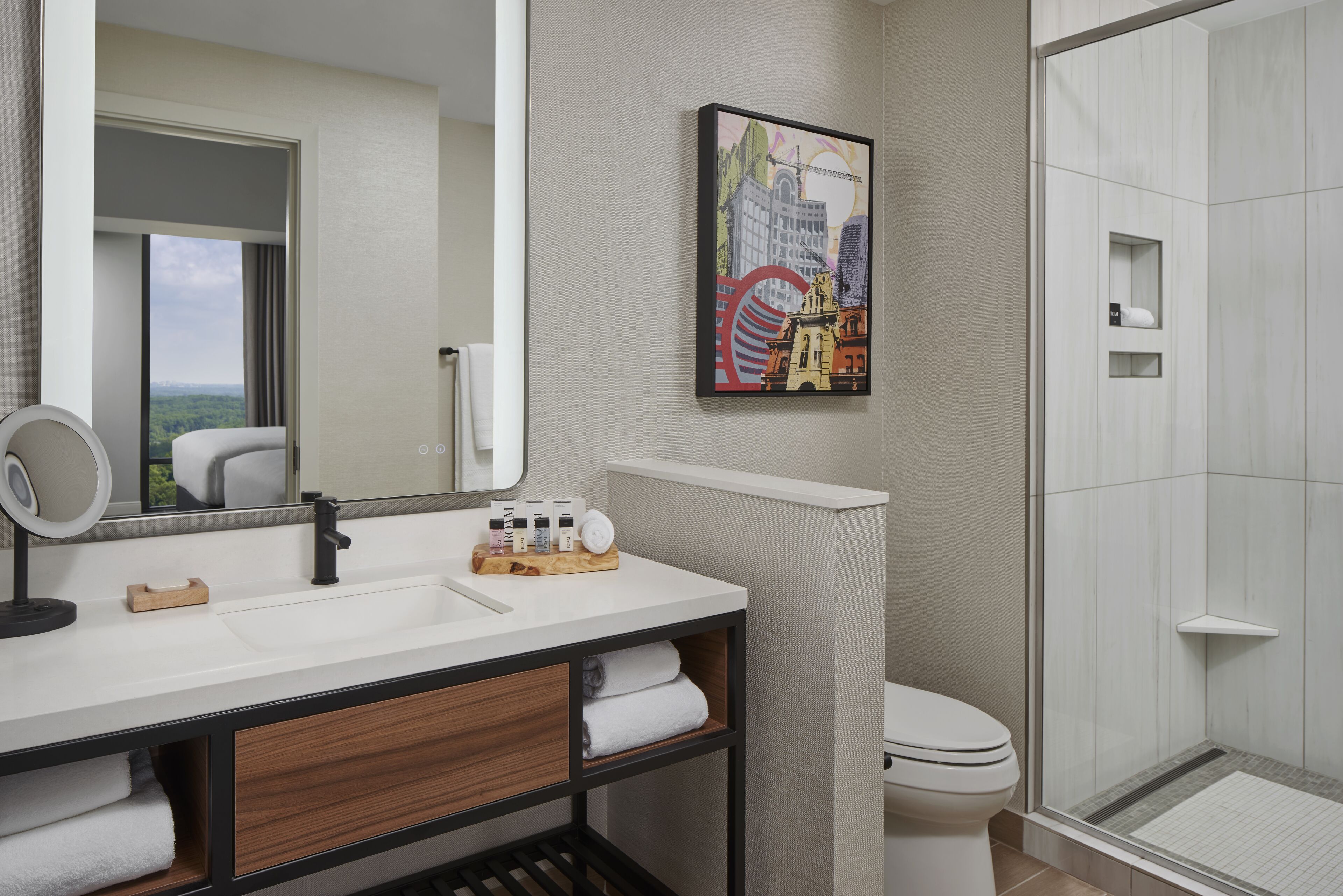 designer toiletries, hair dryer, towels, soap