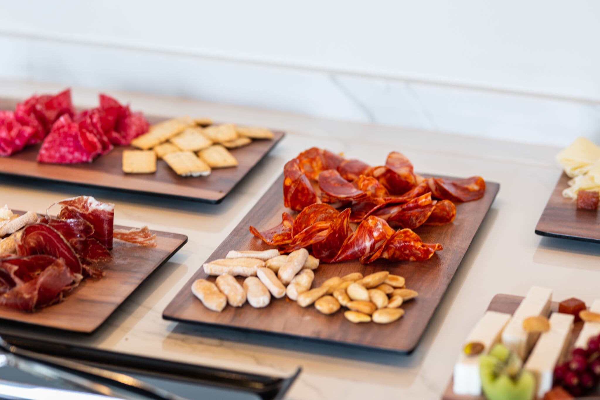 A variety of food items displayed on wooden boards.