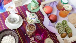 A table set with various food items, a teapot, and a cup. - In the heart of Naples (Napoli)