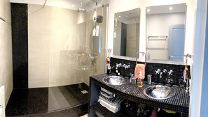 Bathtub, hair dryer, towels, soap