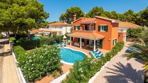 A two-story house with a swimming pool, outdoor seating, and a garden. - Villa Gabriel Son Parc by Villa Plus (Son Parc)
