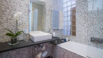 Combined shower/tub, hair dryer, towels, soap