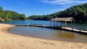 A lakeside beach with a wooden pier and a gazebo. - Amazing Chalet Hot Tub Sauna Fire Pit Pet Friendly (Brevard)