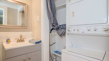 Combined shower/tub, hair dryer, towels, soap