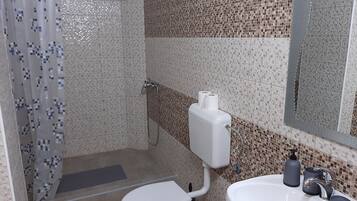 Doccia, asciugamani, sapone, carta igienica