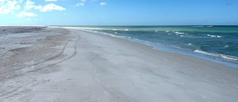 On the beach, sun-loungers, beach towels