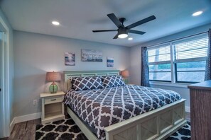 A bedroom with a bed, a ceiling fan, a window with curtains, and artwork on the wall. - *Coastal 2/2 Condo w/ Pool 6 Mins to IMG (Bradenton)