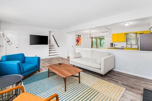 TV, fireplace - Steps to Ridge Road Beach Renovated Home w/ Private Hot Tub, Firepit & Porch (Grand Beach)
