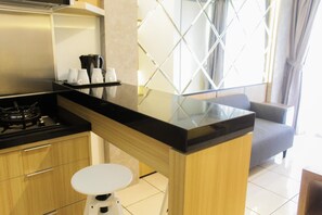 Room | Private kitchen | Fridge, microwave, stovetop, dishwasher - Modern and Clean 2BR Apartment at M-Town Residence (Gading Serpong)