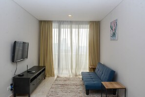 Living area - Great Choice 1BR at The Empyreal Apartment (Jakarta)