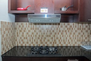 Fridge, stovetop, cookware/dishes/utensils - Great Choice 1BR at The Empyreal Apartment (Jakarta)