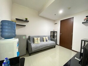 Room | Living area | TV - Scenic & Stylish 1BR at Gateway Pasteur Apartment (Cimahi)