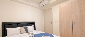 Modern 2BR Room at Meikarta Apartment By Travelio