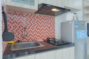 Room | Private kitchen | Fridge, stovetop, cookware/dishes/utensils - Cozy Stay and Homey Studio Apartment at Bassura City Apartment (Jakarta)