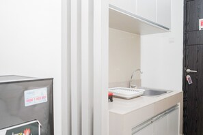 Room | Free WiFi, bed sheets - Warm Studio at Baileys Apartment (South Tangerang)