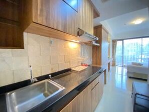 Room | Free WiFi, bed sheets - Spacious Studio Room at Beverly Dago Apartment (Bandung)